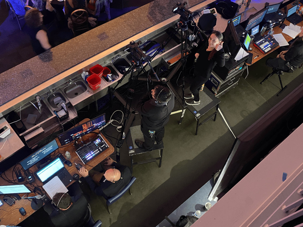 An overhead view of people at production station at event