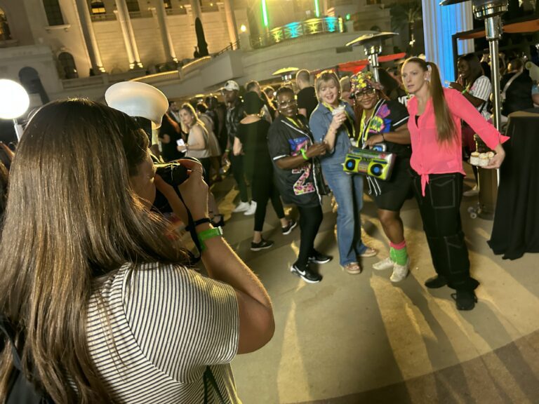 Event photographer taking photo of attendees