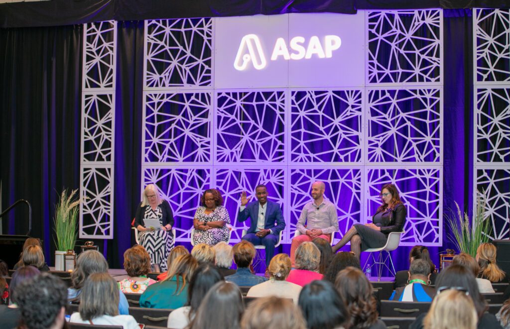 Panelists on stage at an event