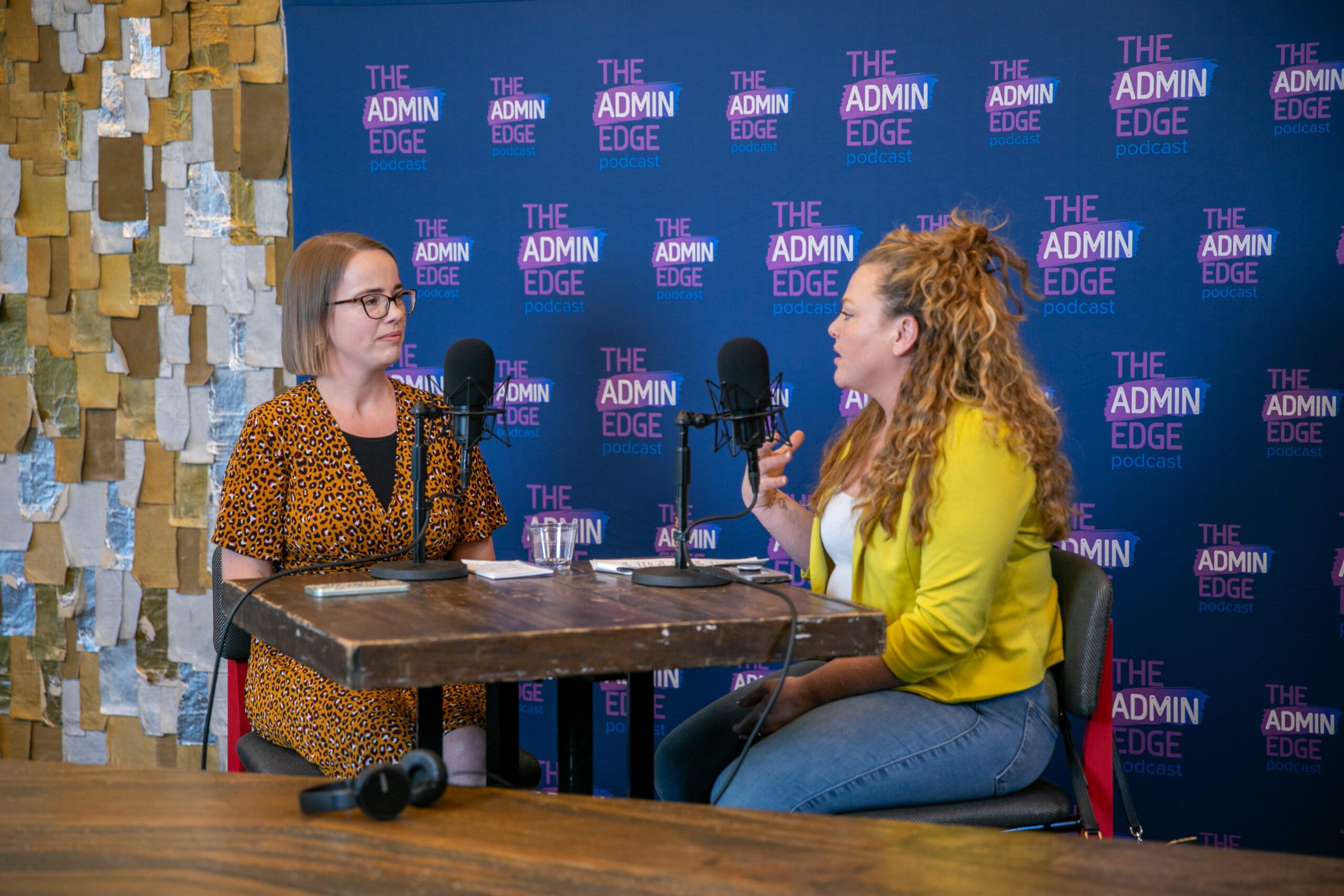 two women sitting on podcast set