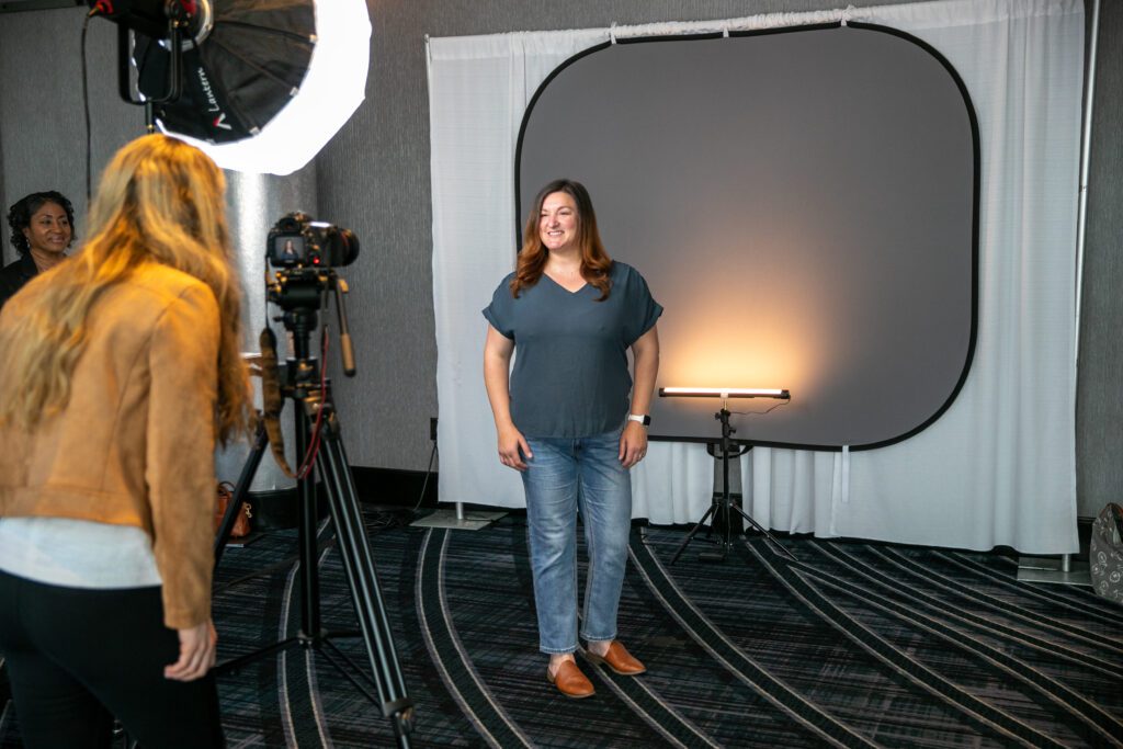 Woman at headshot booth at event