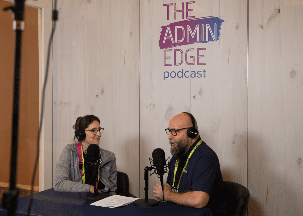 two people sitting in podcast booth creating event content