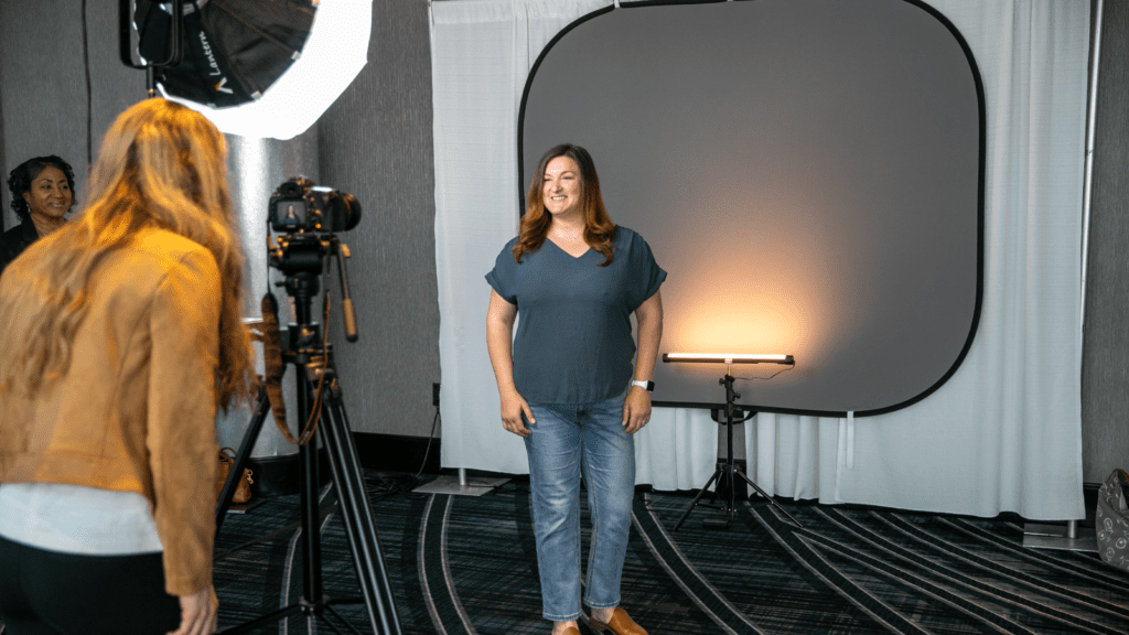 Woman at headshot booth at an event