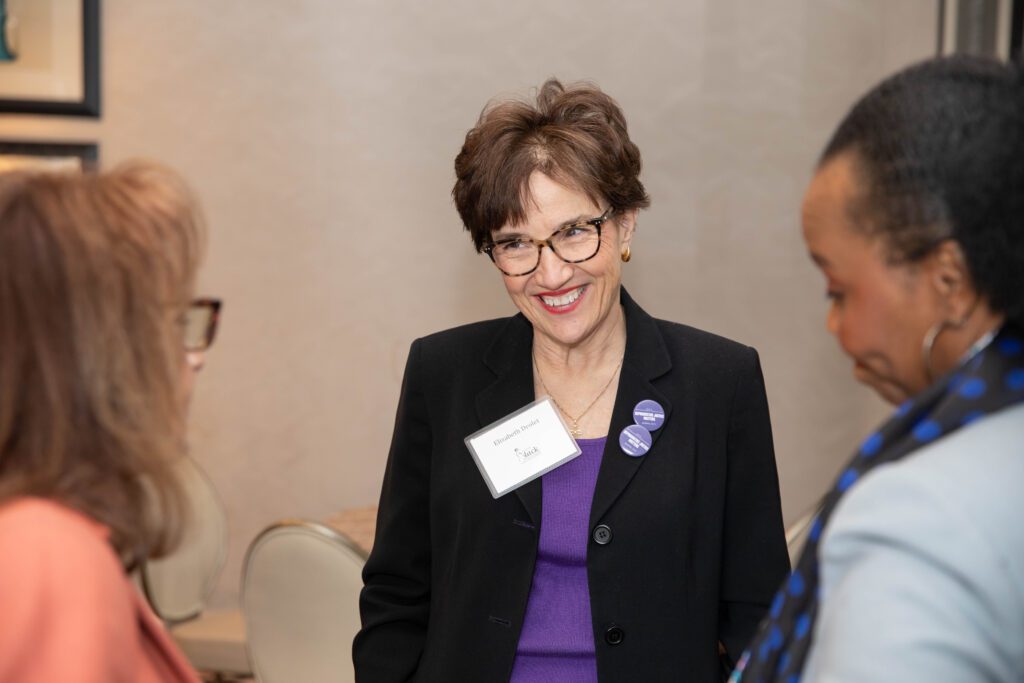 Woman smiling at conference