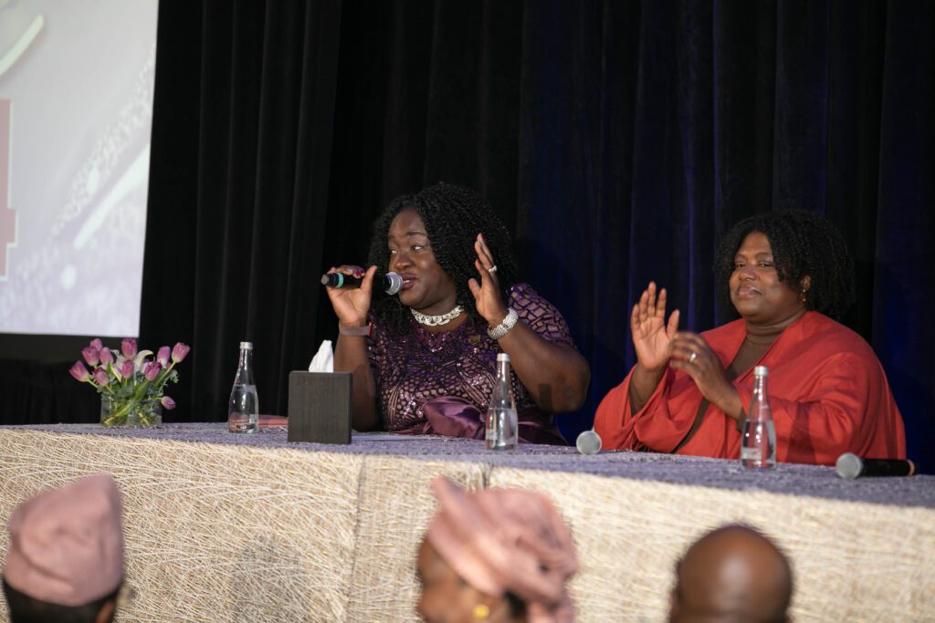 Woman speaking on panel at event