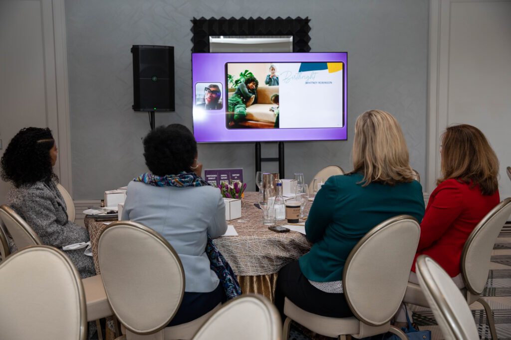 People looking at screen at conference