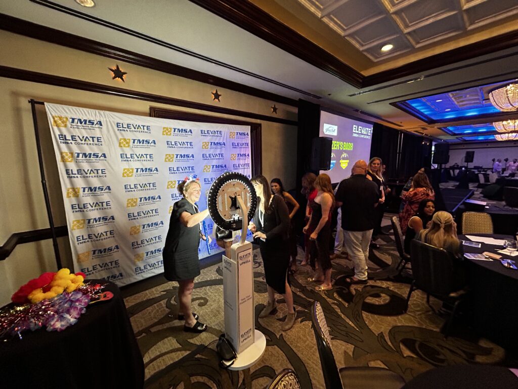 Guests enjoying interactive photo booth rental at and event